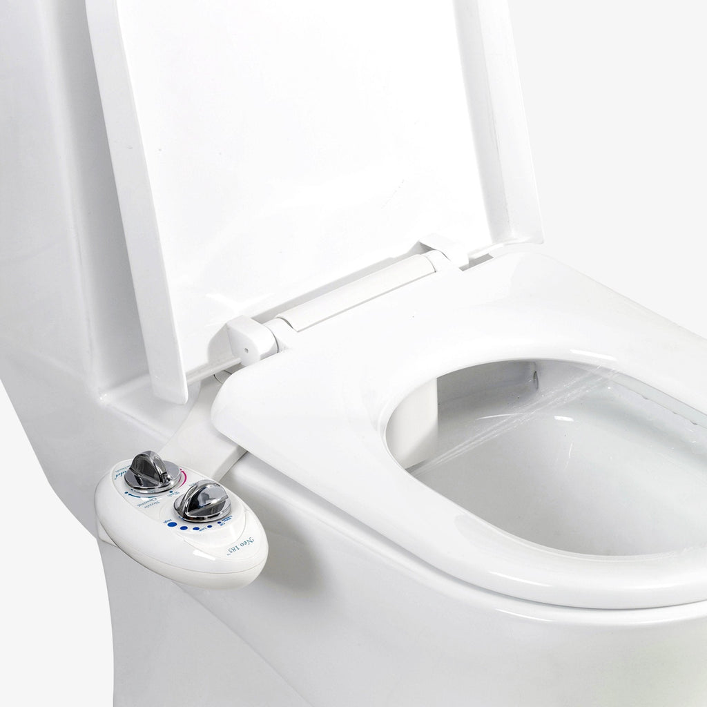 NEO 185: Imperfect Packaging - NEO 185 White installed on a toilet with water spraying from nozzles