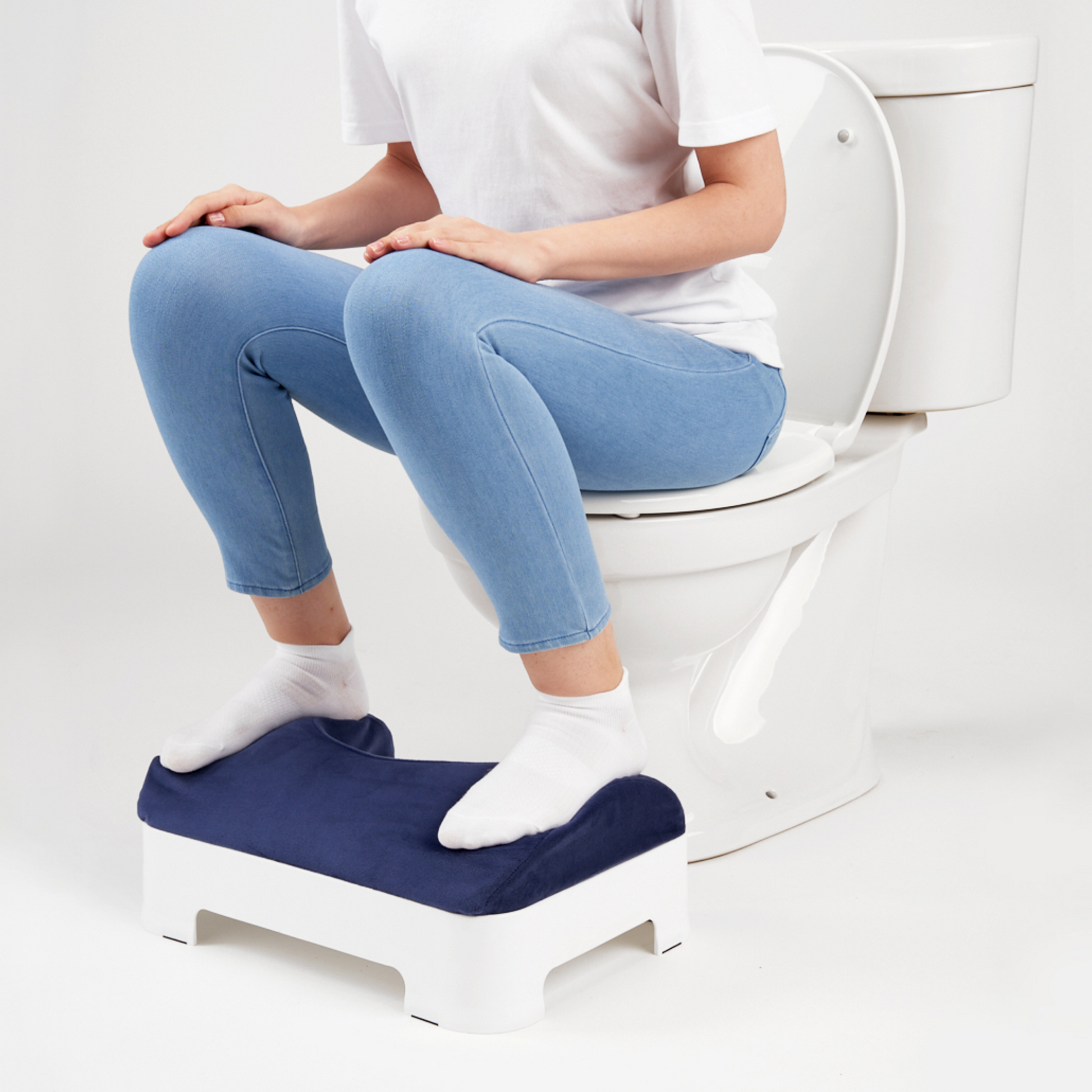 Model using LUXE Footstool with Dark Navy Velour Cover Installed