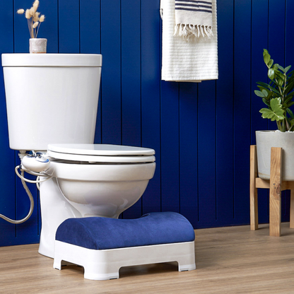 Dark Navy Velour Footstool Cover installed on LUXE Footstool in modern bathroom