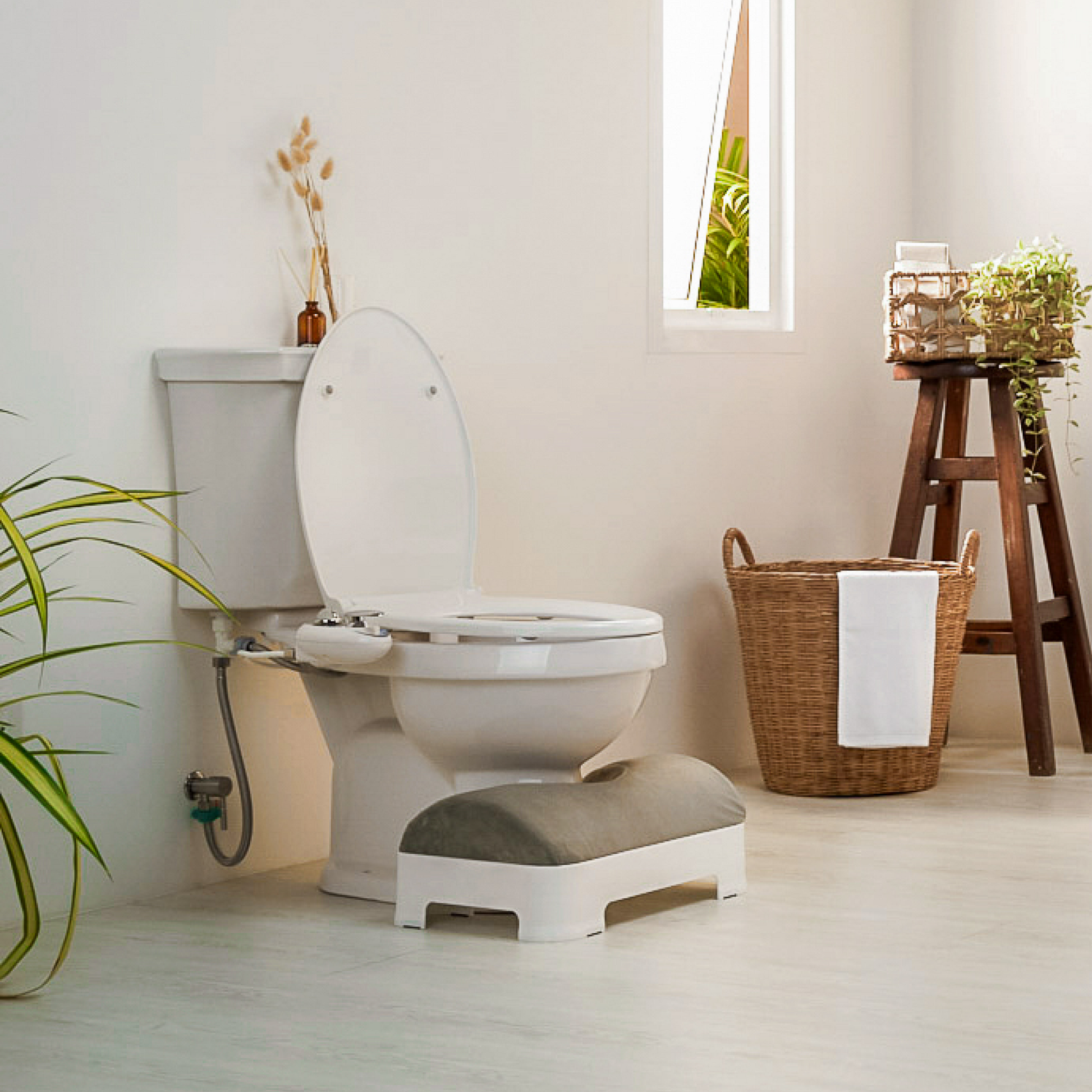 Soft Gray Velour Footstool Cover installed on LUXE Footstool in modern bathroom