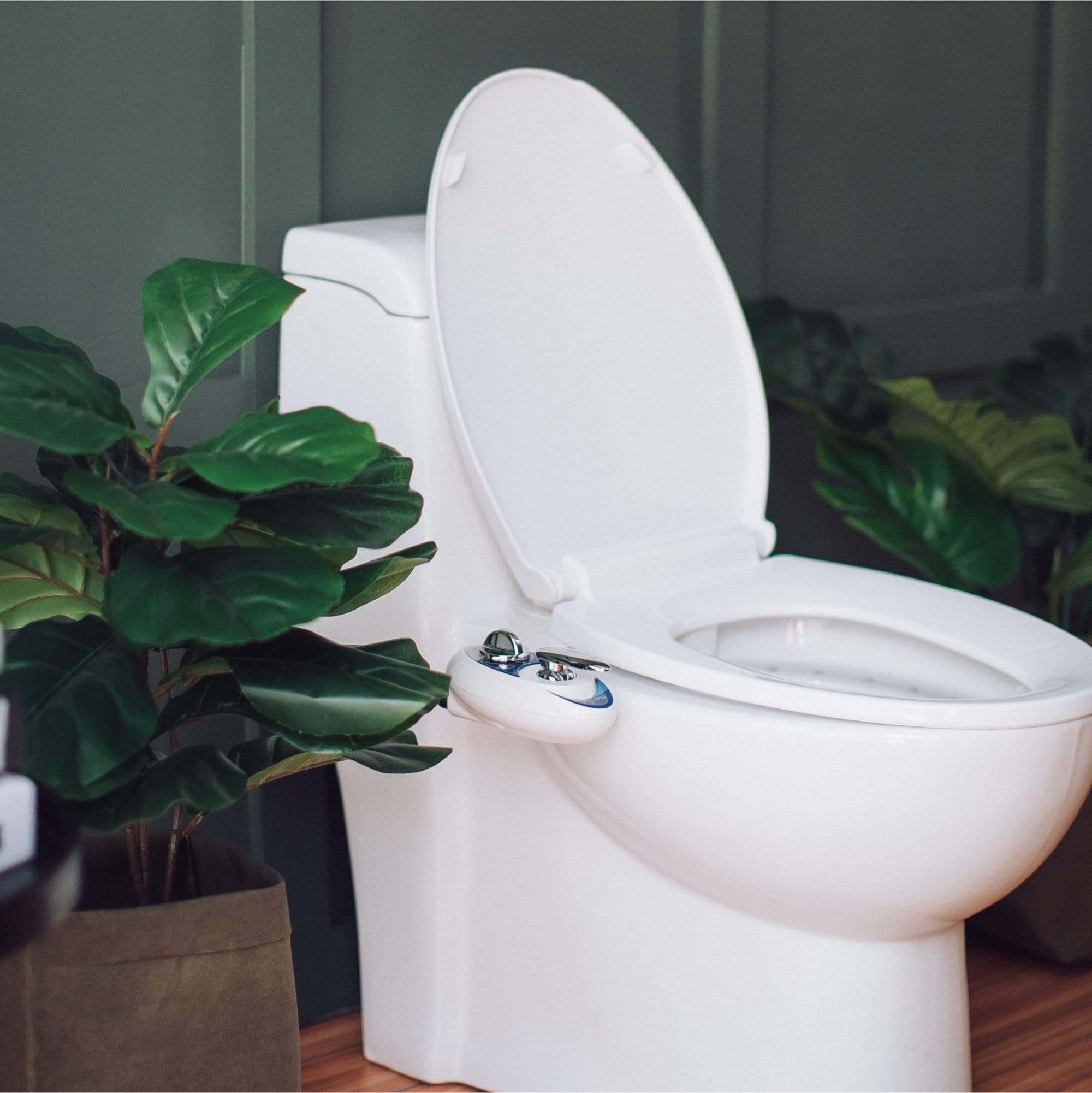 NEO 180: Imperfect Packaging - NEO 180 Blue installed on a toilet, in a modern bathroom with plants