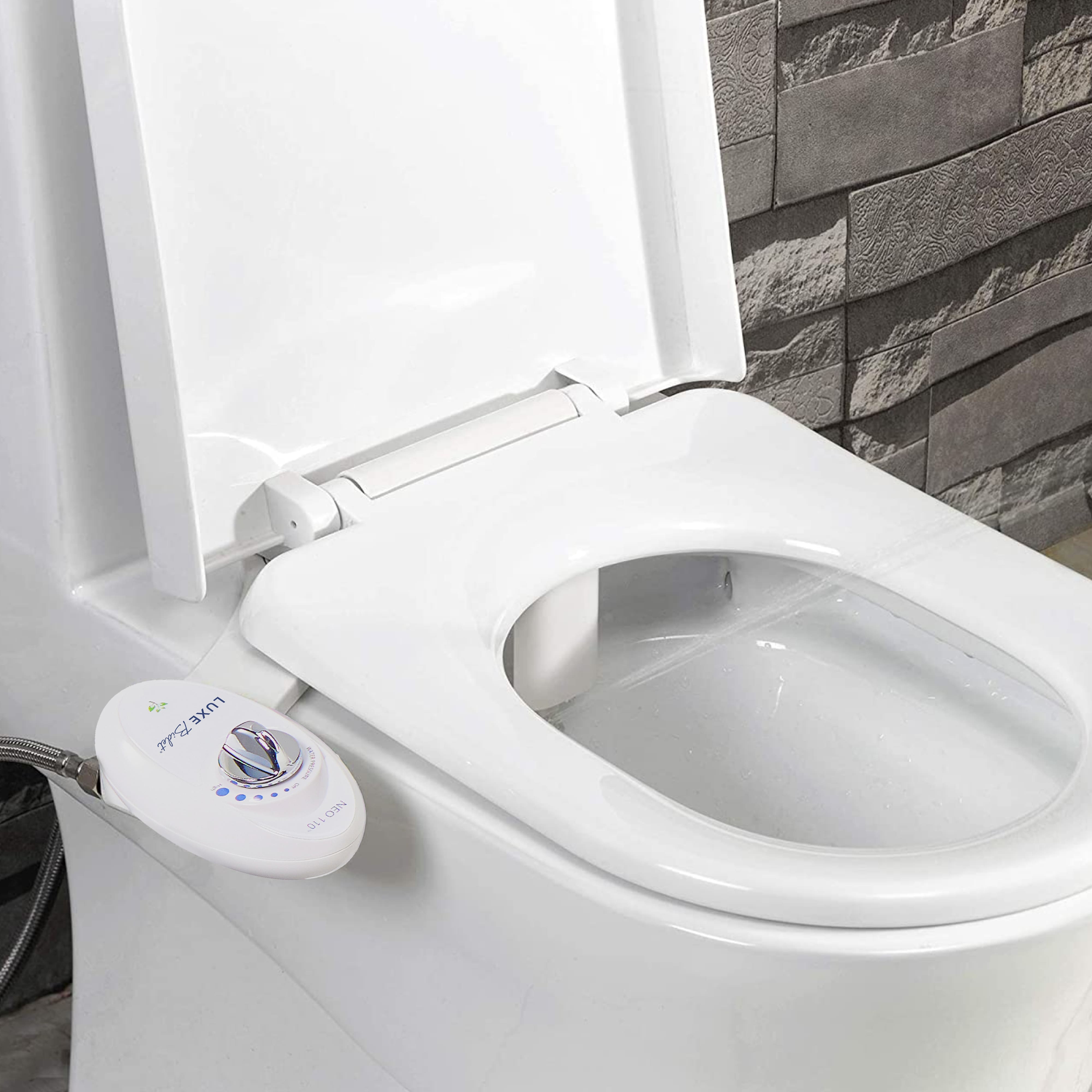 NEO 110 White installed on a toilet with water spraying from nozzles