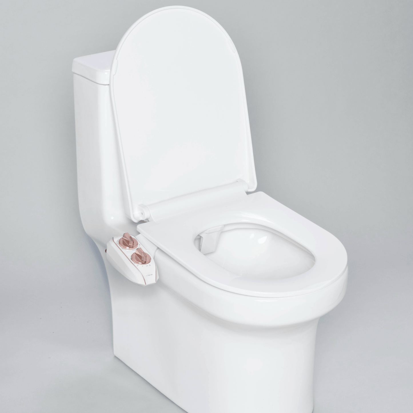 NEO 185 Plus Rose Gold installed on a modern toilet, with lid open