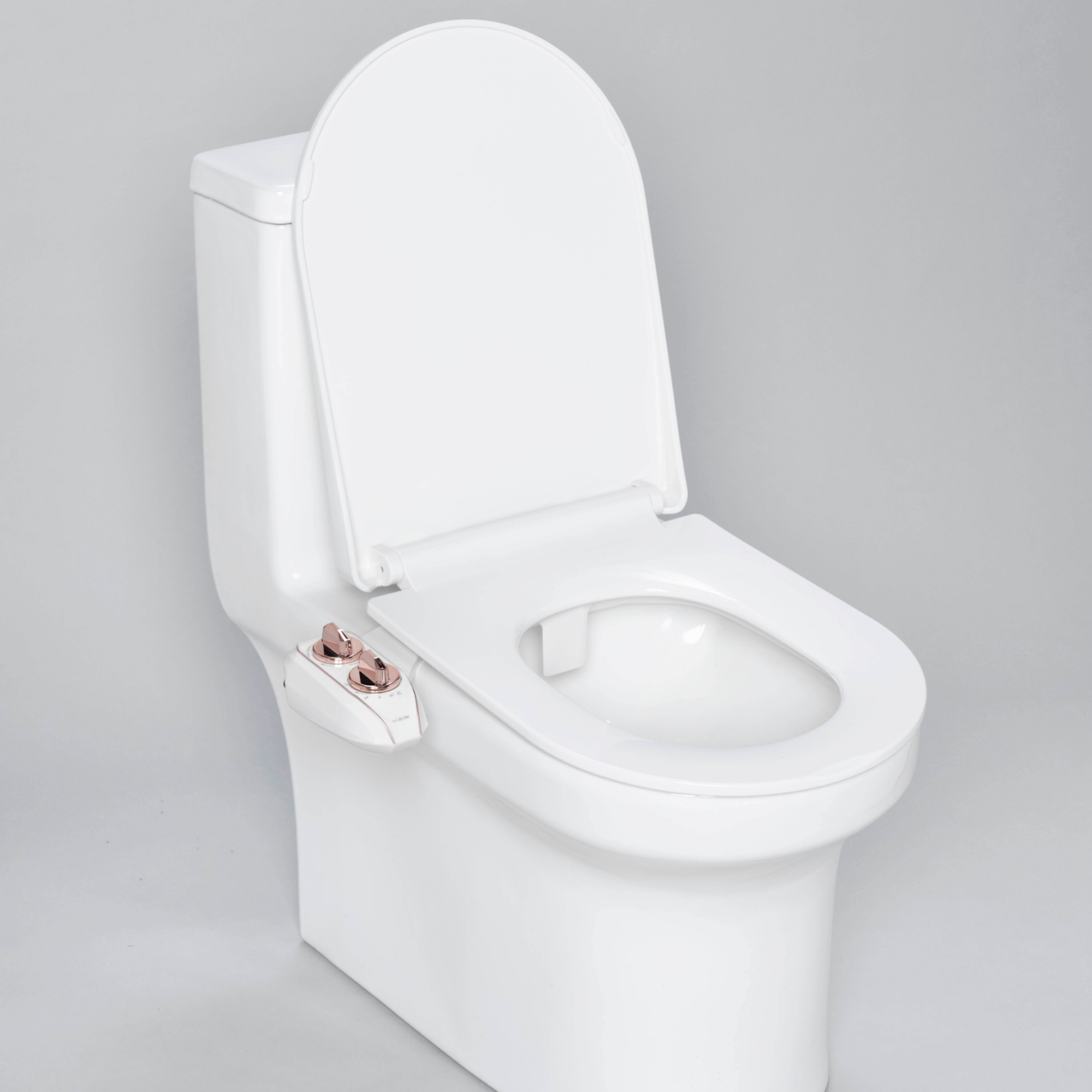NEO 120 Plus: Imperfect Packaging - NEO 120 Plus Rose Gold installed on a modern toilet, with lid open