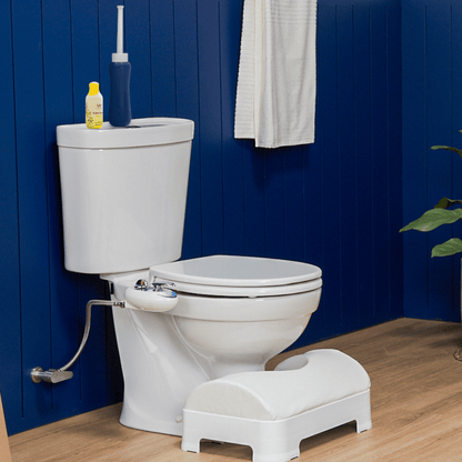 LUXE Portable Bidet resting on toilet tank of a modern bathroom