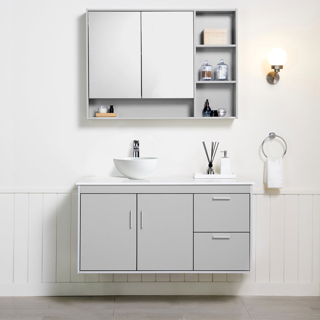 Arista Bathroom Vanity Set, front-facing with bathroom décor & toiletries on counter and in cabinets