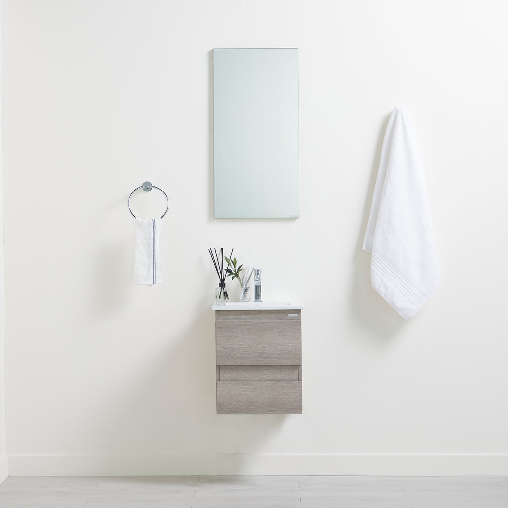 Eleni Bathroom Vanity Set, front-facing with bathroom décor & toiletries on counter and in cabinets