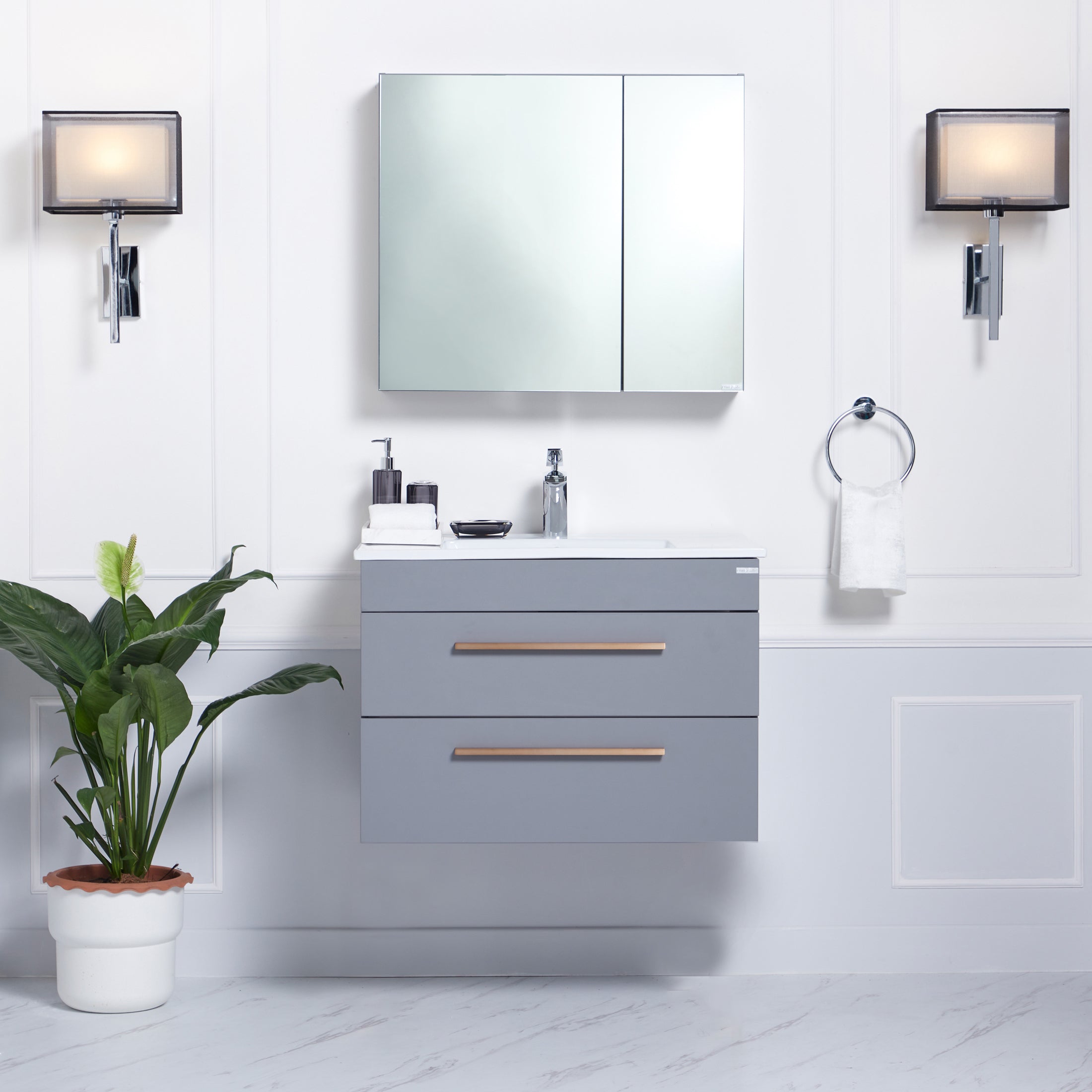 Rhea Bathroom Vanity Set, front-facing with bathroom décor & toiletries on counter and in cabinets