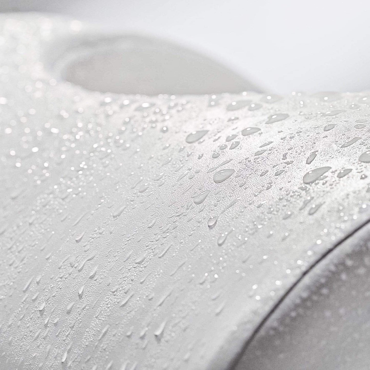 Waterdrops on the LUXE Footstool cover to showcase its waterproof feature