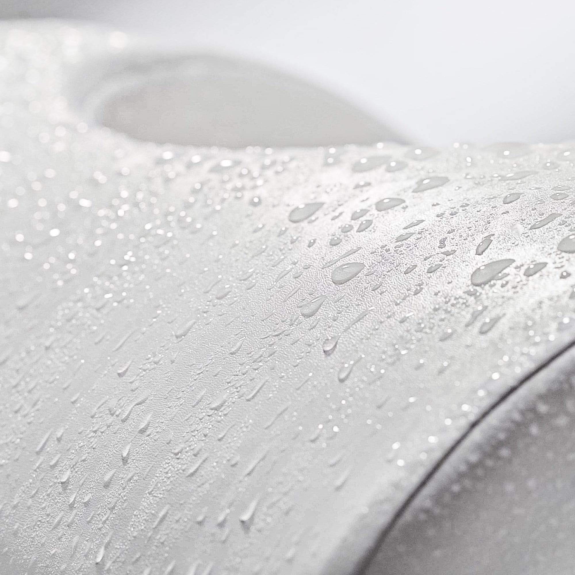 LUXE Footstool up-close with water droplets to showcase waterproof PU leather