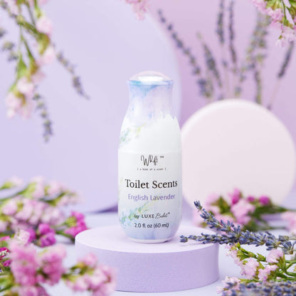 60 mL English Lavender Whift Toilet Scents Spray on platform with blurred background of flowers