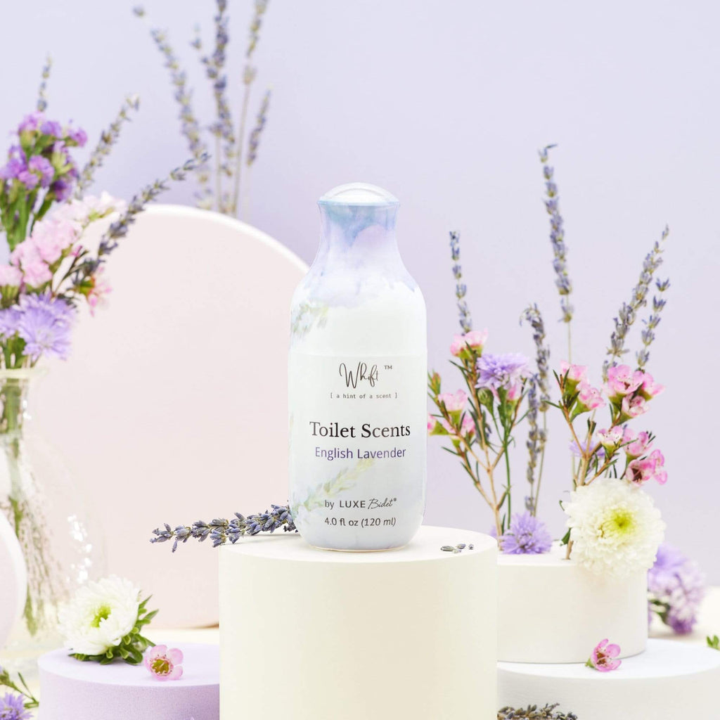 Whift Toilet Scents Spray - 120 mL English Lavender Whift Toilet Scents Spray on platform, surrounded by flowers